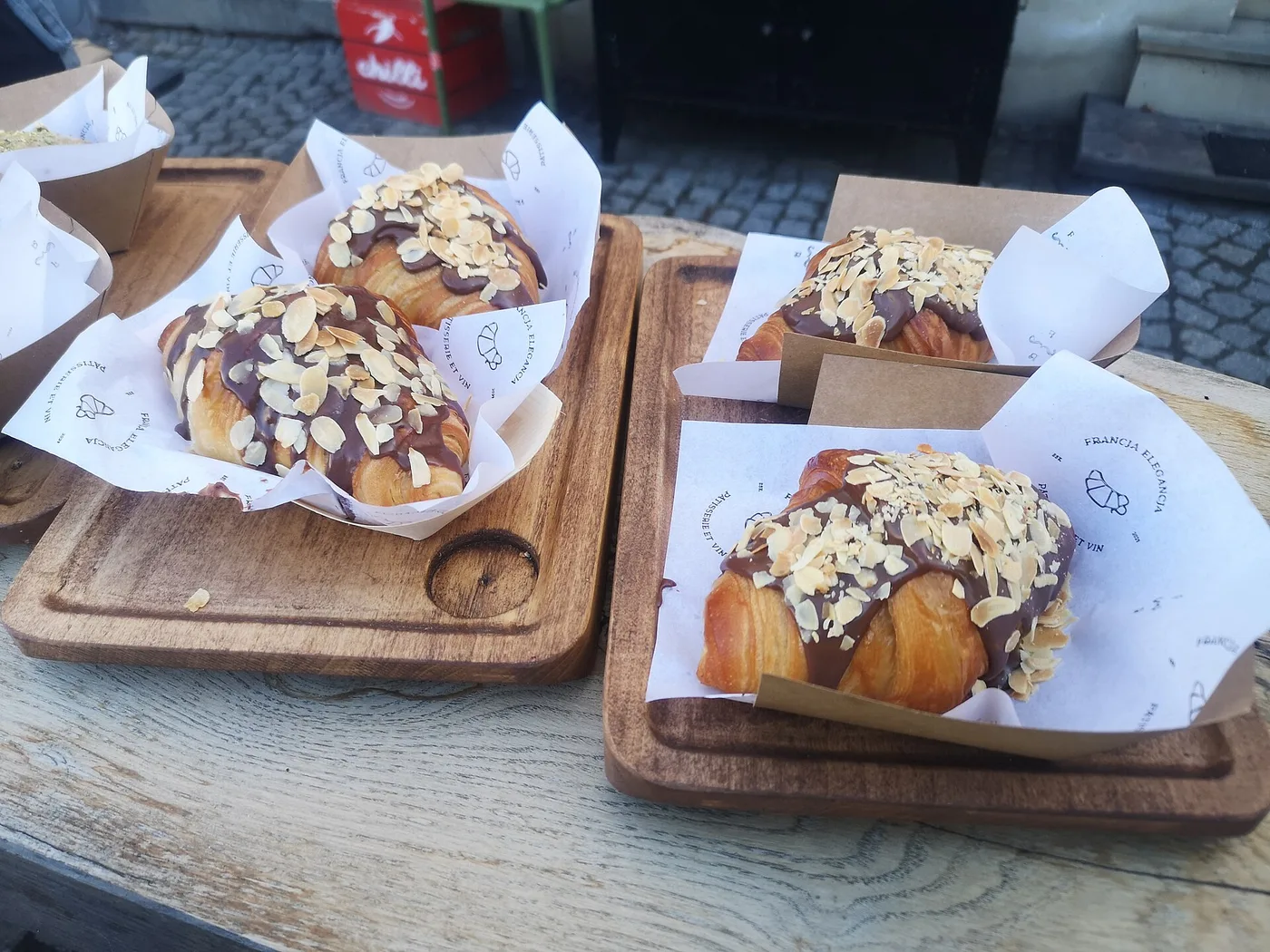 Chocolate and almond croissants on wooden boards. The photo was not taken in Roswell.