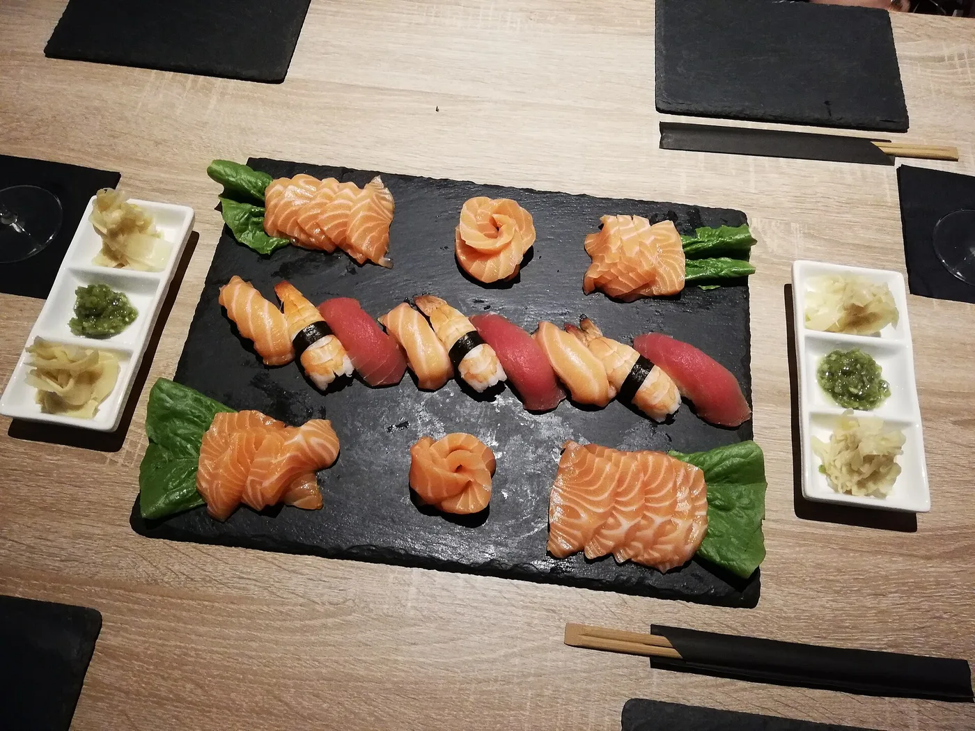 A plate of salmon and tuna nigiri and sashimi. The photo was not taken at a Roswell restaurant.